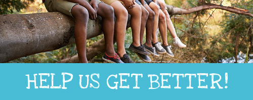 Teenagers sitting on a tree limb